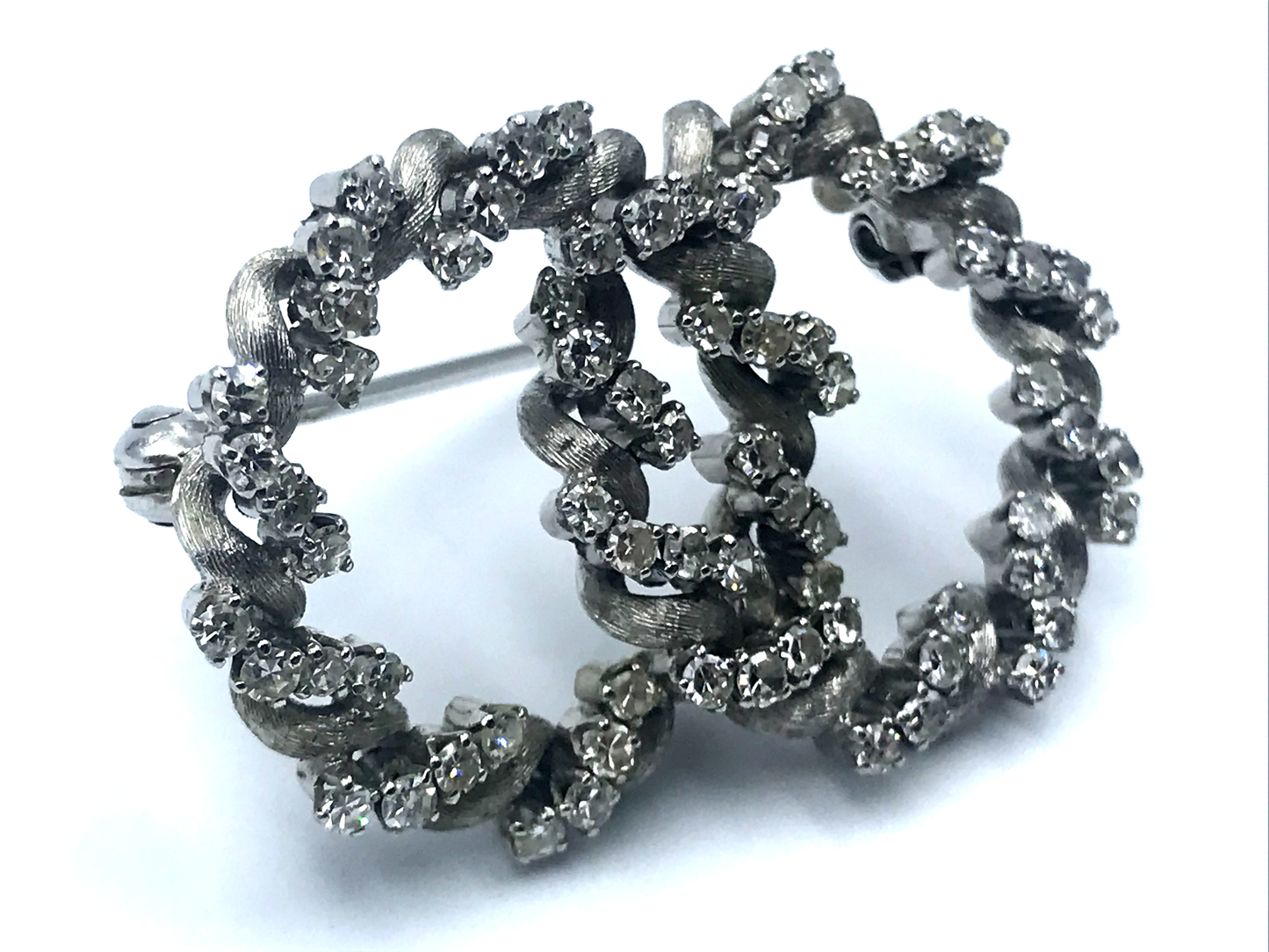 Double circle brooch with diamonds