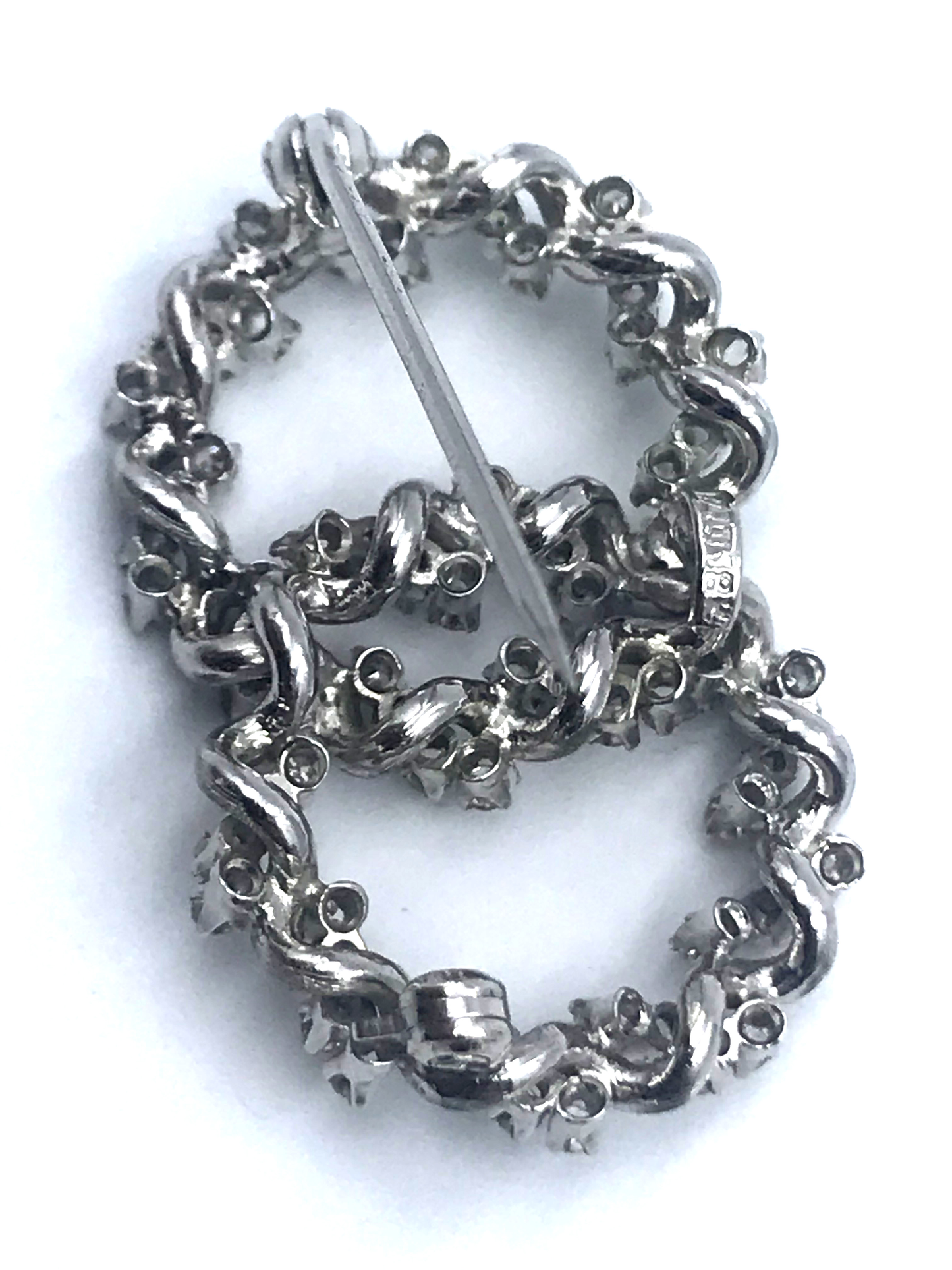 Double circle brooch with diamonds